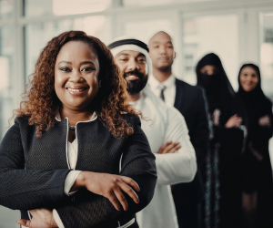 Group of diverse persons posing with their arms folderd