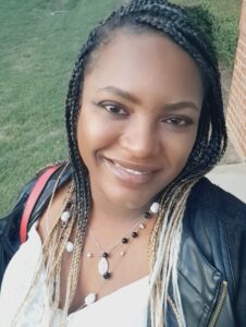 woman with braids smiling