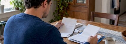Employee comparing health coverage information at home